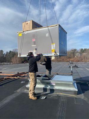 Jay Moody HVAC technnicians installing a new roof top unit for our customer!