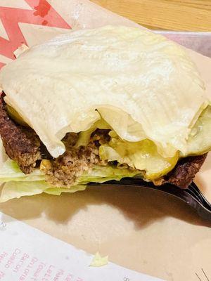 VEGAN Burger in lettuce wrap with pickles, bbq sauce