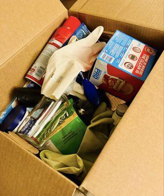 Opening cleaning supplies and at the bottom of the box there was food in cardboard boxes