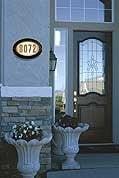 Elegant house numbers in cast aluminum, bronze, brass and more.  Lighted house plaques come in a variety of shapes and colors.