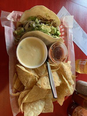 Beef taco with onions and guacamole