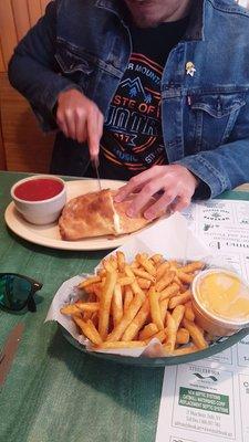 Yummy calzone and cheese fries