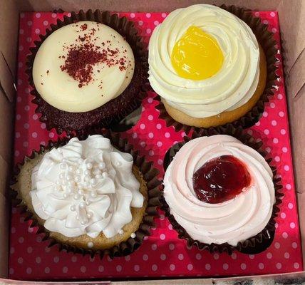 (Top Left) Red Velvet Cupcake (Top Right) Lemon Drop Cupcake (Bottom Left) Wedding Cake Cupcake (Bottom Right) Strawberry Cupcake