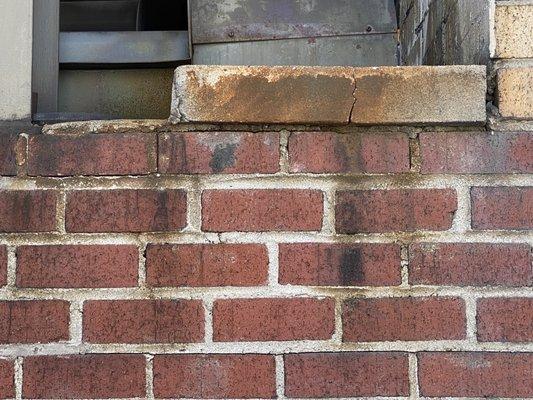 Typical bricks on the east facade. A dump!