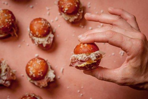 COUNTRY HAM & SAUERKRAUT SLIDERS [DF] WHOLE GRAIN MUSTARD. PRETZEL BUN