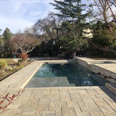 Up close view of the pavers, and the stone wall.