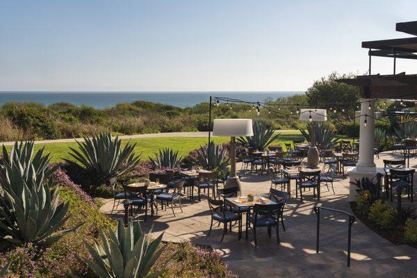 Outdoor dining patio featuring ocean views.