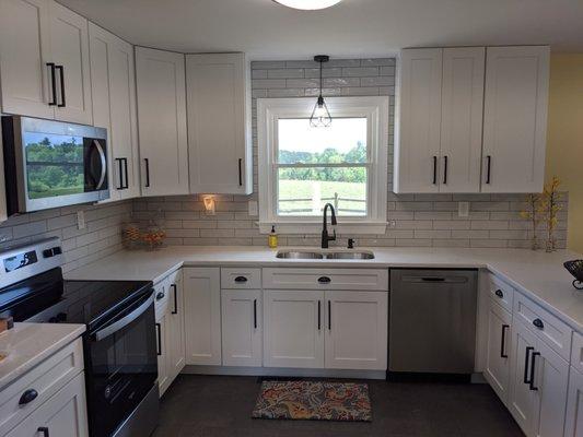 Most recent job from DIY. White shaker cabinets with soft close with quartz countertops. Turned out beautifully