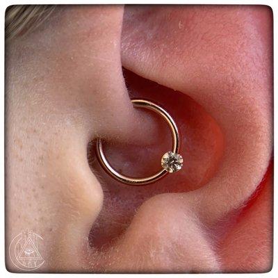 Healed daith with a free floating gem gold ring