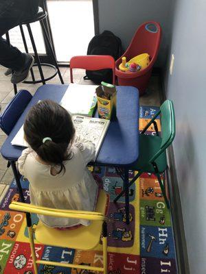 Kids corner in the waiting area. Brand new coloring books and fun toys. Very impressed!