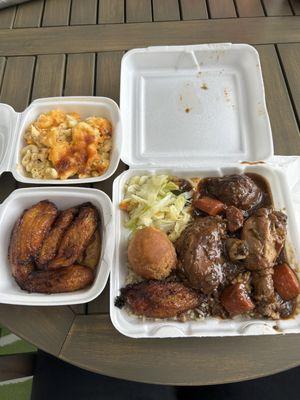 Small Brown Stewed Chicken with steamed veggies and a side of macaroni and plantains