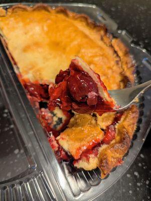 Fresh-baked Whole Foods cherry pie. Still warm out of the oven when I picked it up tonight. $7.99 for one half pie. So good.