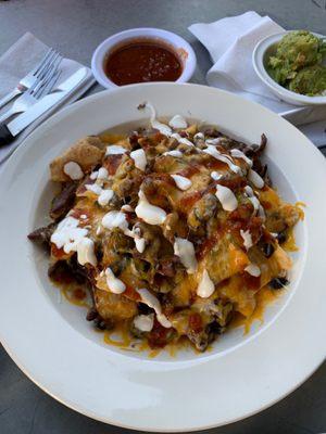 Loaded nachos with carne asada