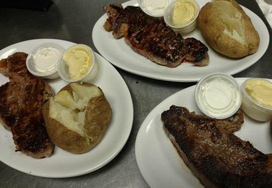 Steak night every Friday starting at 5p. 2 steaks, ( ribeye or New York strip ) 2 salads, 2 baked potatoes, and 2 soft drinks, tea, or water