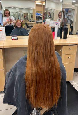 before the haircut; gorgeous, long, ginger hair and a big smile.