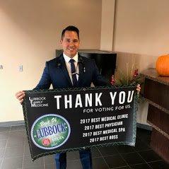 Dr. Mendez holding our sign! We won Best of Lubbock 2017 for best clinic, best physician, best medical spa, and best boss!!!