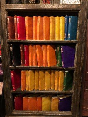 Leather bound books in a rainbow of colors.