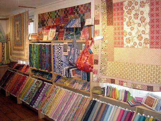 Our wall of Kaffe Fassett fabric.