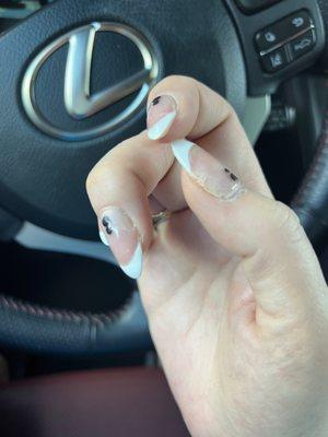 Whole lower half of nail ripped off due to my hair being caught under it. (Also ripped out my hair too) Refused to fix