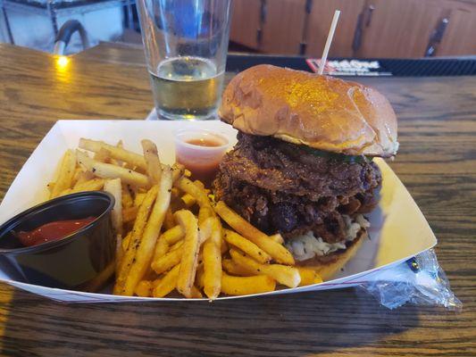 Fried chicken sandwich with fries.