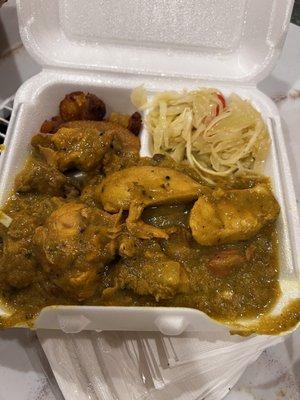 Curried chicken with a side of plantain and cabbage