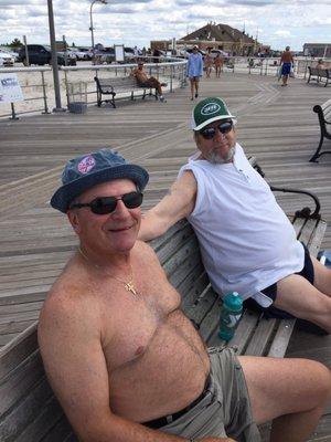 Two wise guys from Jones Beach. Jets and Yankee hats.