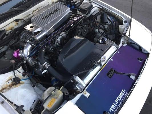 Co-Owner Jon's personal FC3S, 2nd generation RX-7, with custom Tri-Point Engineering factory mount intercooler.