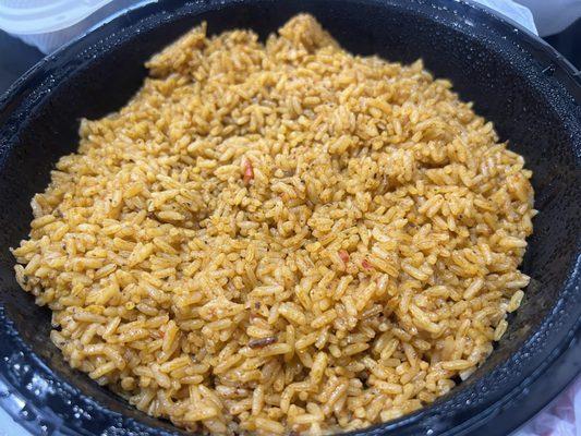 Malian Jollof Rice = Jasmine, Basmati or broken rice cooked in well seasoned sauce with an abundance of flavor.