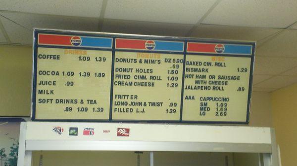 Menu board. Note that the cappuccino is of the powdered machine made variety.