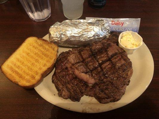 Ribeye, baked potato and Texas toast