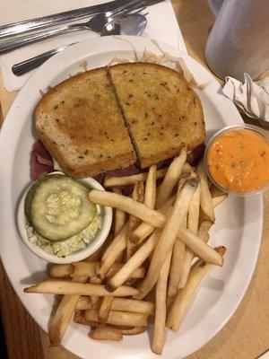 A delicious Ruben with fries