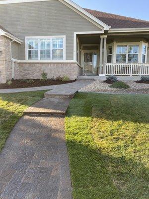 New paver walkway and steps leading to front door in Aurora CO