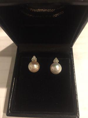 *I took in the pearls, that's why they don't match in color*  Pearl earrings with 3 diamonds, gold backing. I love them!