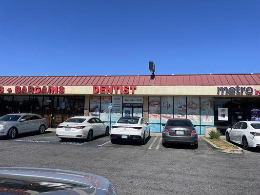 Front of dentist office and parking lot