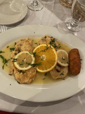 Chicken Francese with a potato croquette.