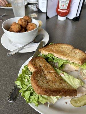 Turkey sandwich with with cranberry mayo and smoked gouda. And hushpuppies. Really good hushpuppies.