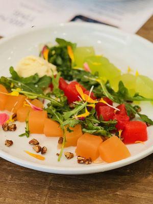 Pressed melons and arugula salad