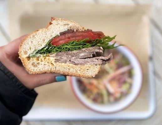 Cold Cut Beef Tongue Sandwich w/ balsamic reduced onion, arugula, tomatoes, garlic+sriarcha aioli, rize up seeded hoagie | $18 + $6 slaw