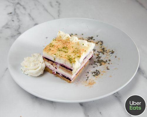 Lasagna cake ( baked merengue, biscuit cream, mixed berry jelly, whipped cream, white chocolate ganache)