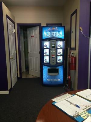 Changing room to the left. Restroom straight ahead. Vending machine that sells $1 water to the right.