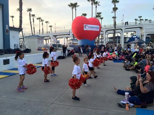 Parks and Rec Cheer Program performing at Junior Seau Beach Amphitheater