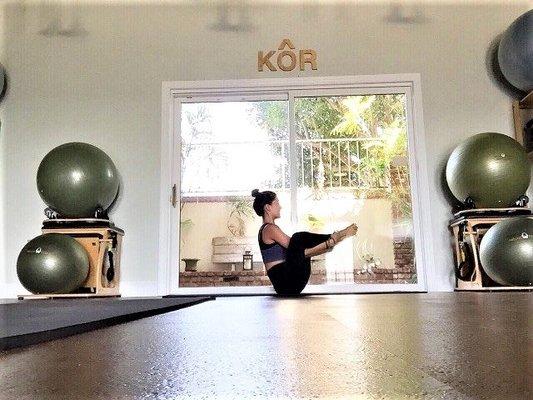 Breanna, KÔR Pilates instructor, performing "Seal Puppy".