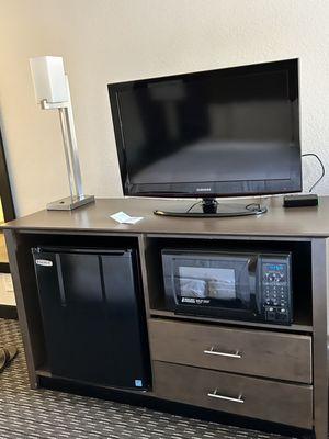 Entertainment area with tv fridge and microwave