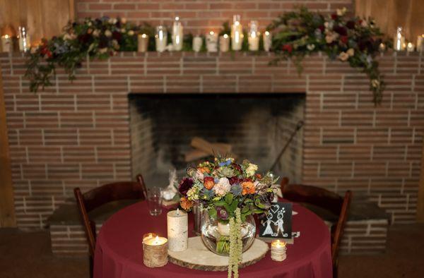 Sweetheart table decorations with rented items and repurposed bridal bouquet.