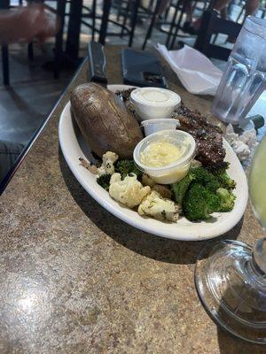 Ribeye with veggies and baked potato