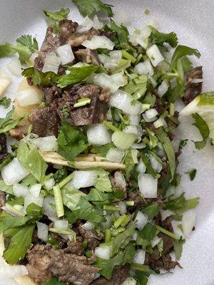 Lengua de res and carne asada taco