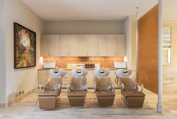 The relaxing shampoo area at Vanity Salon, the best salon in Houston Heights, featuring Houston's best haircuts and and Aveda salon products