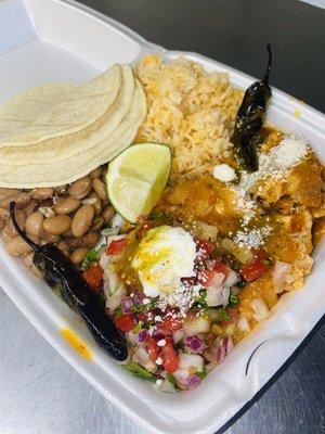 Chipotle Chicken plate with everything on it. Comes with a side of rice, beans, and 6 corn  tortillas.