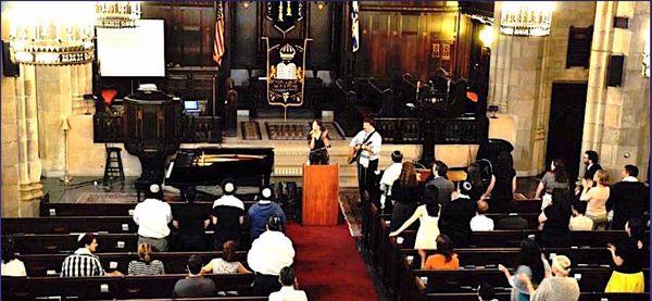 Regular Shabbat Worship Service with Rabbi & Rebbetzin leading Pesukei D'Zimra (songs of worship segment).