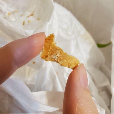 Piece from Banh Mi sandwich that has a dark blue-ish color underneath the white powder. Hard to tell from photo, but noticeable in person.